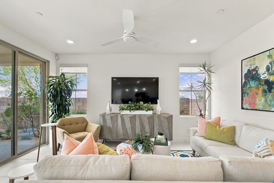 Living room with wall-mounted TV and cream sectional