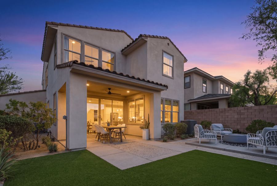 Sample virtual twilight photo of a backyard at dusk with glowing windows